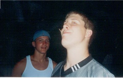 Pickle has some fun with a toothpick 
while Chris looks on in fascination.